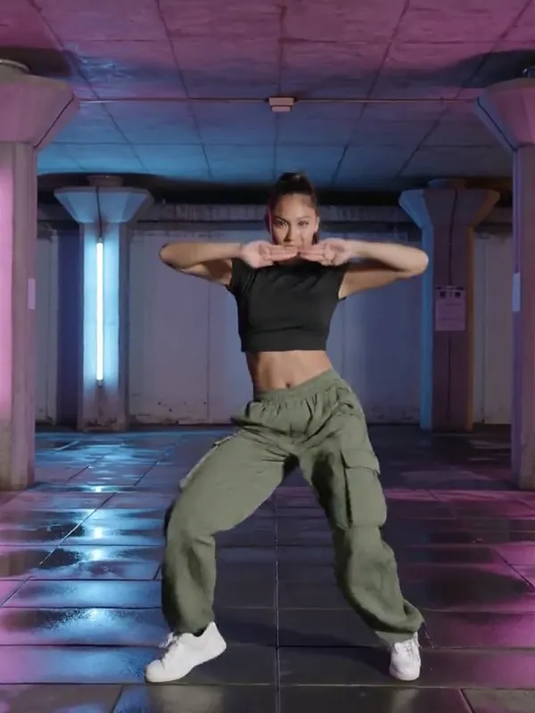 Text to video AI free without watermark example — hip-hop dancer under neon lights by Kling 3.0